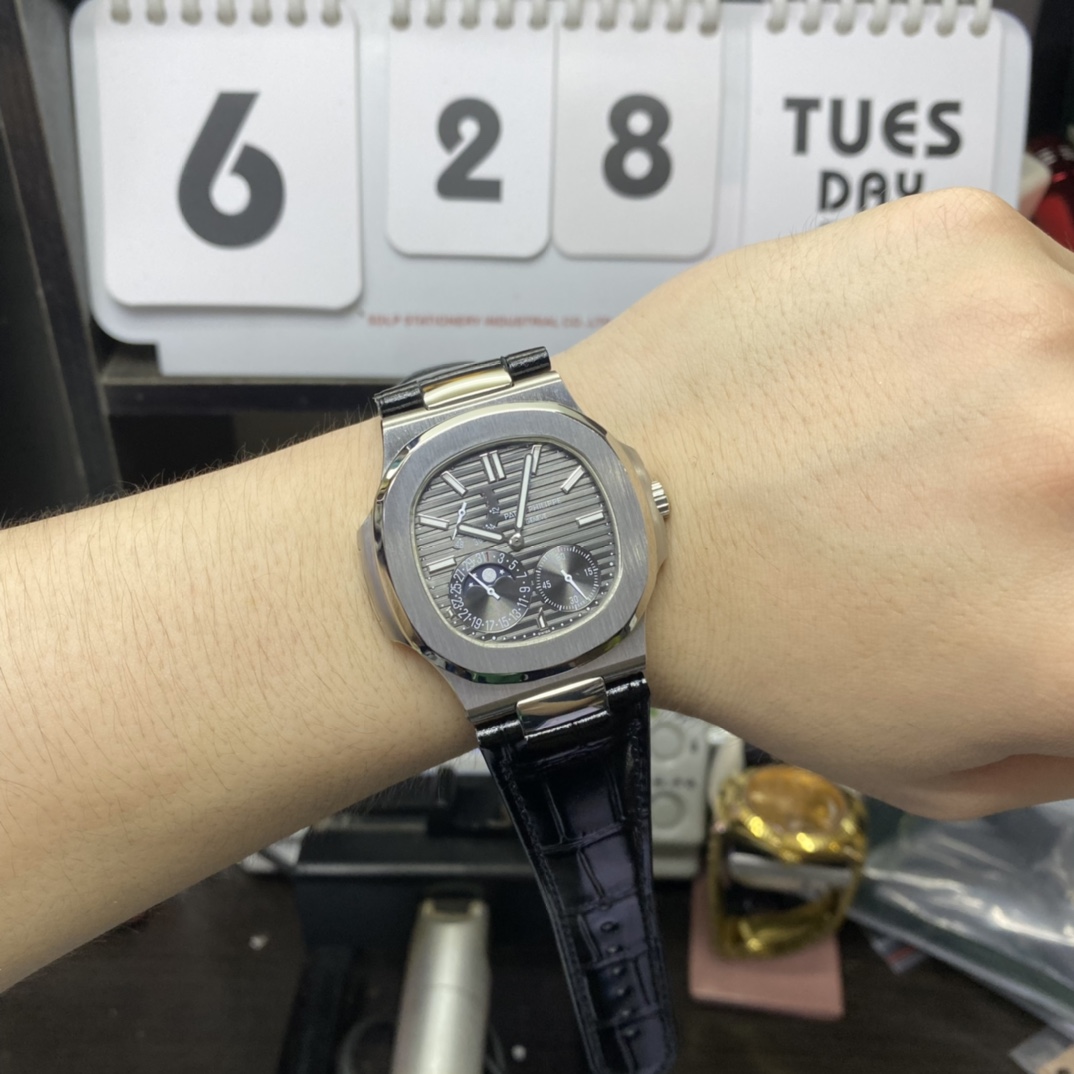 Patek Philippe Nautilus series 5712G-001, Stainless Steel Case Grey Dial Black Leather Strap, 40mm size.