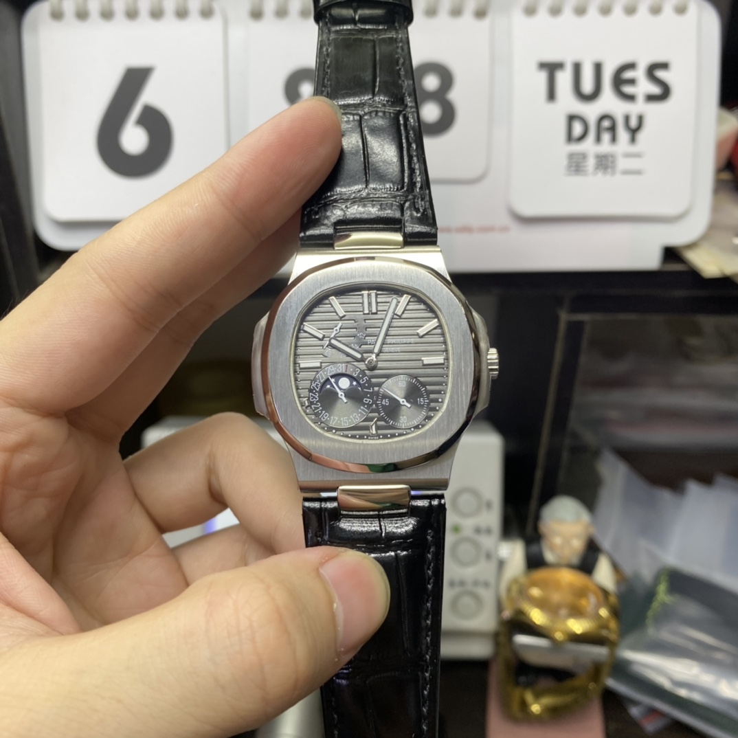 Patek Philippe Nautilus series 5712G-001, Stainless Steel Case Grey Dial Black Leather Strap, 40mm size.