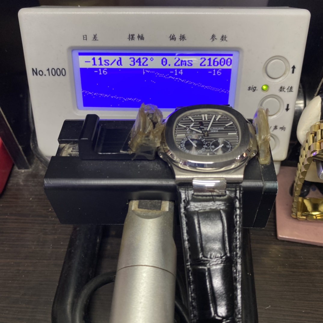 Patek Philippe Nautilus series 5712G-001, Stainless Steel Case Grey Dial Black Leather Strap, 40mm size.