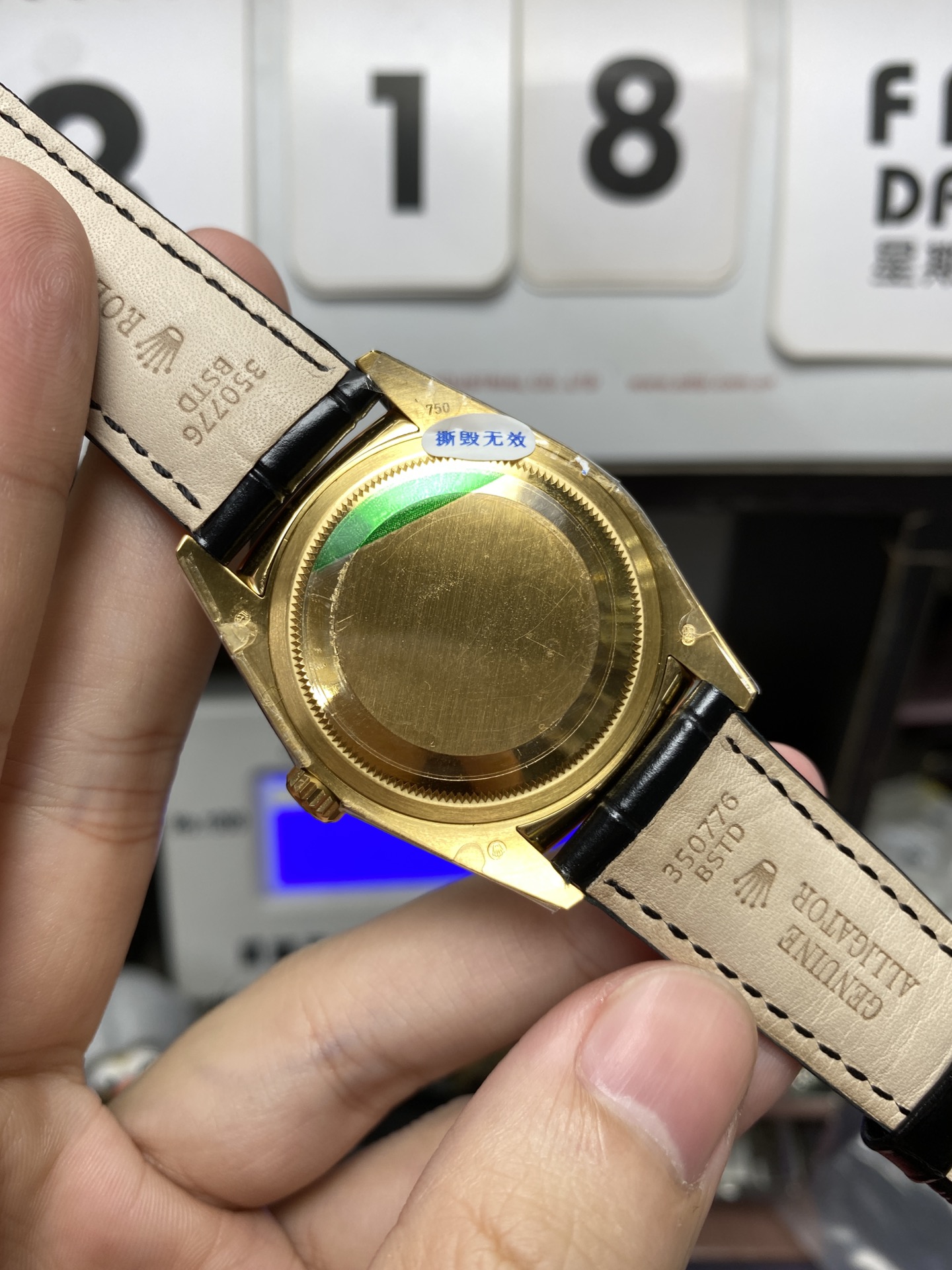 Rolex Day-Date Series 118135, Black Dial Gold Case with a leather strap, 36mm size.