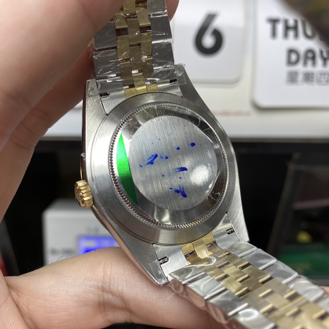 Rolex Datejust series m126333-0006, two-tone gold case black dial with diamond markers and a five-link two-tone gold bracelet, 41mm size.