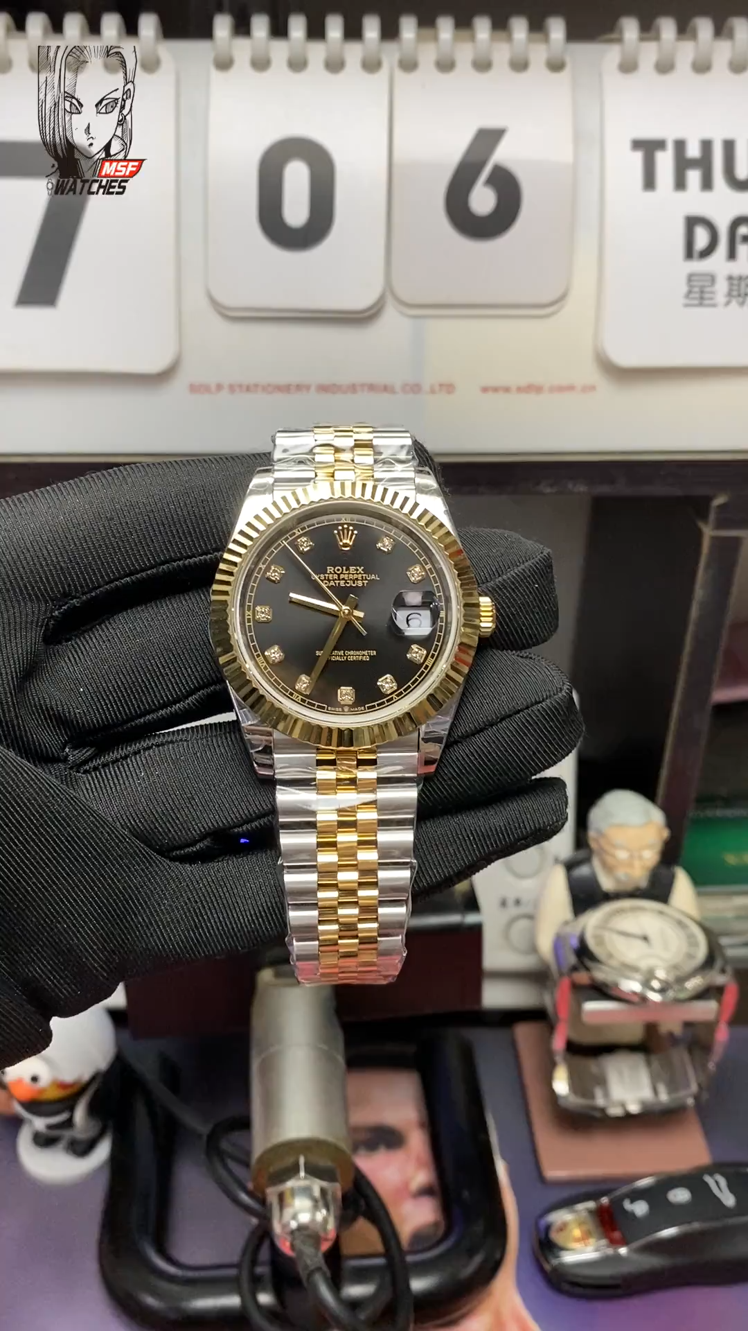 Rolex Datejust series m126333-0006, two-tone gold case black dial with diamond markers and a five-link two-tone gold bracelet, 41mm size.