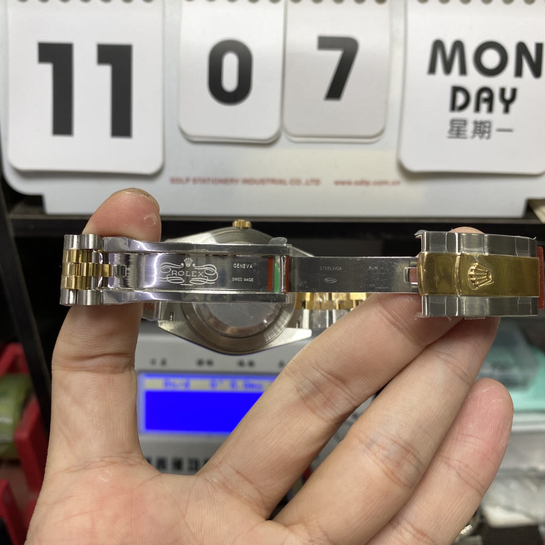 Rolex Datejust series m126333-0006, two-tone gold case black dial with diamond markers and a five-link two-tone gold bracelet, 41mm size.