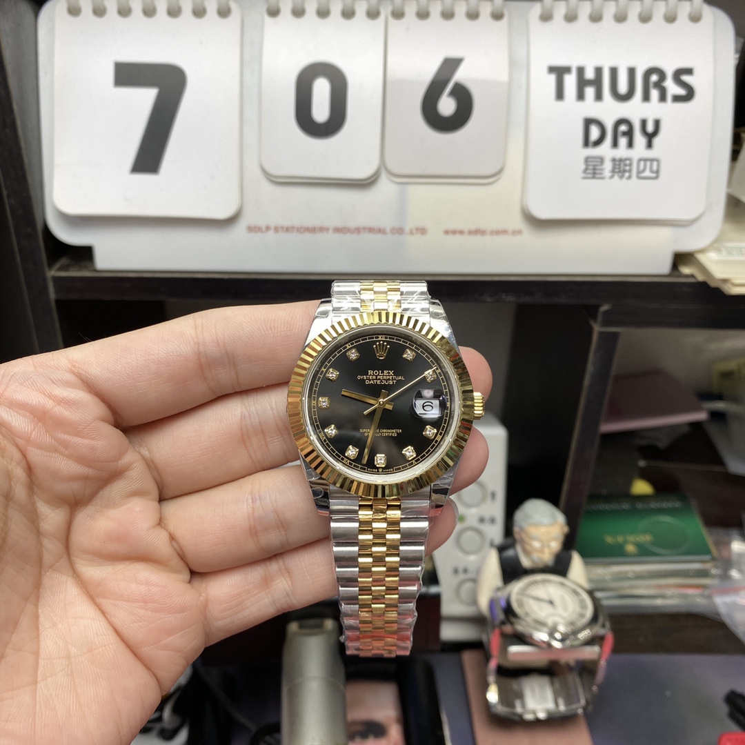 Rolex Datejust series m126333-0006, two-tone gold case black dial with diamond markers and a five-link two-tone gold bracelet, 41mm size.